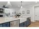 Island with stainless appliances, farm sink and ample seating, great for entertaining at 125 Lord Ashley Rd, Raleigh, NC 27610
