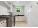 Well-organized laundry room featuring modern appliances and ample storage space at 125 Lord Ashley Rd, Raleigh, NC 27610