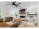 Cozy living room with stone fireplace, built in cabinets and lots of natural light at 125 Lord Ashley Rd, Raleigh, NC 27610