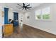 Well-lit home office with custom cabinetry, hardwood floors, and bright windows at 125 Lord Ashley Rd, Raleigh, NC 27610