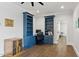Bright home office featuring custom built-ins, providing ample storage space at 125 Lord Ashley Rd, Raleigh, NC 27610