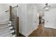 Elegant staircase with dark wood steps and iron balusters, and great lighting at 125 Lord Ashley Rd, Raleigh, NC 27610