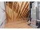View of the unfinished room with exposed studs and HVAC System at 125 Lord Ashley Rd, Raleigh, NC 27610