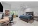 Bedroom/office space with a desk, gaming chair, and large bed is a versatile design at 1305 Queensferry Rd, Cary, NC 27511
