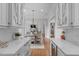 Open-concept dining area with a round table, stylish decor, and view to the living room at 1305 Queensferry Rd, Cary, NC 27511