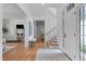 Welcoming entryway with hardwood floors, staircase, and view of the living room at 1305 Queensferry Rd, Cary, NC 27511
