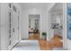 Elegant foyer with hardwood floors offering views into the living room and kitchen at 1305 Queensferry Rd, Cary, NC 27511