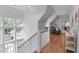Bright hallway featuring hardwood floors, statement windows, and stylish decor at 1305 Queensferry Rd, Cary, NC 27511
