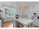 Spacious kitchen with marble island, custom cabinets, stainless appliances, open to dining at 1305 Queensferry Rd, Cary, NC 27511