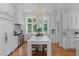 Bright, spacious kitchen with marble island, custom cabinets, and professional-grade range at 1305 Queensferry Rd, Cary, NC 27511