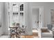 Bright living room nook featuring large windows, hardwood floors, and neutral decor at 1305 Queensferry Rd, Cary, NC 27511