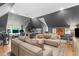 Large living room with a comfortable seating area, desk area, and pitched ceilings at 1305 Queensferry Rd, Cary, NC 27511