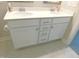 Bathroom with a double sink vanity, white cabinetry, and modern fixtures at 1311 Arena Ln, Fuquay Varina, NC 27526
