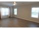 Bright bedroom featuring a ceiling fan and two windows providing lots of natural light at 1311 Arena Ln, Fuquay Varina, NC 27526