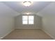 Spacious carpeted room offers natural light with vaulted ceiling at 1311 Arena Ln, Fuquay Varina, NC 27526