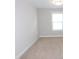 Bedroom with neutral colored carpet and fresh paint, offering a blank slate ready to be personalized at 1311 Arena Ln, Fuquay Varina, NC 27526