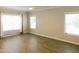Bright bedroom with hardwood floors and large windows that offer plenty of natural light at 1311 Arena Ln, Fuquay Varina, NC 27526