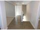 Hallway boasts new flooring and fresh paint, creating a welcoming and move in ready space at 1311 Arena Ln, Fuquay Varina, NC 27526