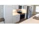 Modern kitchen featuring white cabinets, stainless steel appliances, and sleek countertops at 1311 Arena Ln, Fuquay Varina, NC 27526