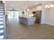 Open-concept living space featuring a large island, stainless steel appliances, and hardwood flooring at 1311 Arena Ln, Fuquay Varina, NC 27526
