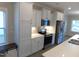 Well-lit kitchen showcases stainless steel appliances, bright white cabinets, and stone countertops at 1311 Arena Ln, Fuquay Varina, NC 27526