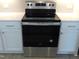 Stainless steel Whirlpool stove with white cabinets, drawers, and sleek countertops at 1311 Arena Ln, Fuquay Varina, NC 27526