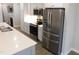 Kitchen featuring stainless steel appliances, white cabinets, and modern design at 1311 Arena Ln, Fuquay Varina, NC 27526