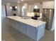 Modern kitchen with stainless steel appliances, center island and open floor plan at 1311 Arena Ln, Fuquay Varina, NC 27526
