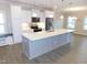 Bright kitchen featuring a large center island with stainless steel appliances at 1311 Arena Ln, Fuquay Varina, NC 27526