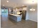 Open-concept kitchen with stainless steel appliances and large center island at 1311 Arena Ln, Fuquay Varina, NC 27526