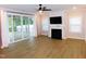Cozy living room with sliding doors, fireplace and mounted television at 1311 Arena Ln, Fuquay Varina, NC 27526