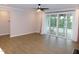 Spacious living room with lots of natural light and sliding glass doors at 1311 Arena Ln, Fuquay Varina, NC 27526