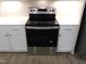 Modern stainless steel oven and white cabinets with stainless steel hardware at 1311 Arena Ln, Fuquay Varina, NC 27526