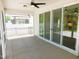 Screened patio with ceiling fan and sliding glass doors, perfect for gatherings at 1311 Arena Ln, Fuquay Varina, NC 27526
