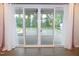 Bright interior view of sliding patio doors with white trim and curtains, showcasing outdoor living space at 1311 Arena Ln, Fuquay Varina, NC 27526