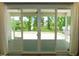 Screened patio with sliding glass doors, perfect for enjoying the outdoors at 1311 Arena Ln, Fuquay Varina, NC 27526