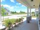 Inviting outdoor area offers a covered porch with stone supports, overlooking the neighborhood street at 1311 Arena Ln, Fuquay Varina, NC 27526