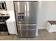 Modern stainless steel refrigerator with water and ice dispenser in a bright kitchen at 1311 Arena Ln, Fuquay Varina, NC 27526