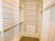 Walk-in closet featuring custom shelves, drawers, and hanging rods for maximum storage at 1311 Arena Ln, Fuquay Varina, NC 27526