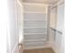Spacious walk-in closet with adjustable shelving and ample storage, providing organization and convenience at 1311 Arena Ln, Fuquay Varina, NC 27526