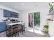 Stylish kitchen with blue cabinets, stainless steel appliances, a modern island, and a sliding door to outdoor patio at 139 Hollyhock Ct, Durham, NC 27713