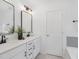 Modern bathroom with double vanity, matte black fixtures, and stylish mirrors at 140 Summer Mist Ln # 159, Clayton, NC 27527