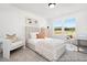 Bright bedroom with large window, neutral carpet, a full bed, and desk area at 140 Summer Mist Ln # 159, Clayton, NC 27527