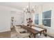 Inviting dining room featuring stylish light fixtures, elegant seating, and bright natural light at 140 Summer Mist Ln # 159, Clayton, NC 27527