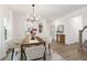 Elegant dining room showcasing modern decor, hardwood floors, and seamless access to other living spaces at 140 Summer Mist Ln # 159, Clayton, NC 27527
