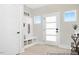 Inviting entryway with built-in bench, storage, and stylish glass-paneled front door at 140 Summer Mist Ln # 159, Clayton, NC 27527