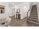 Welcoming foyer with stylish console table, contemporary mirror, and elegant staircase at 140 Summer Mist Ln # 159, Clayton, NC 27527