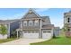 Beautiful two-story home highlighting the spacious 3-car garage and landscaped front yard at 140 Summer Mist Ln # 159, Clayton, NC 27527