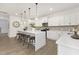 Contemporary kitchen boasts a large center island, pendant lighting, and ample counter space at 140 Summer Mist Ln # 159, Clayton, NC 27527