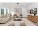 Inviting living room featuring neutral tones, stylish decor, and ample natural light at 140 Summer Mist Ln # 159, Clayton, NC 27527